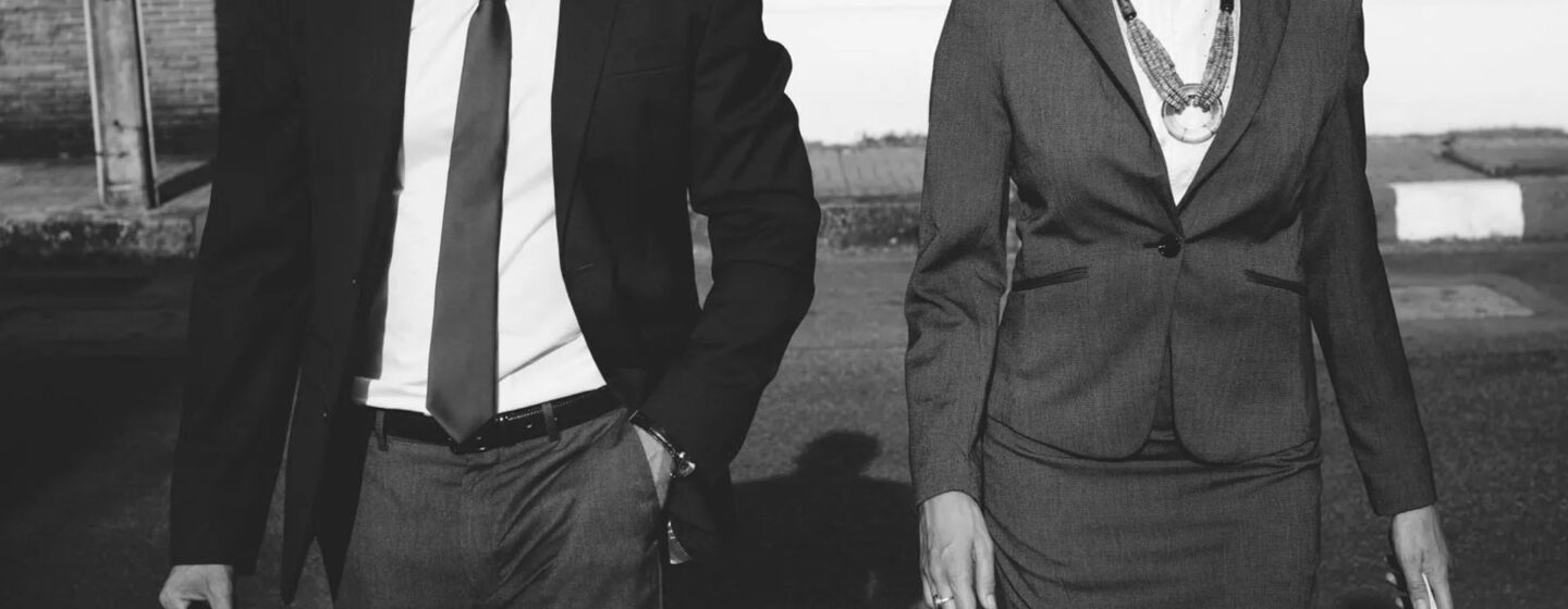 Man and woman in business attire - dry cleaning
